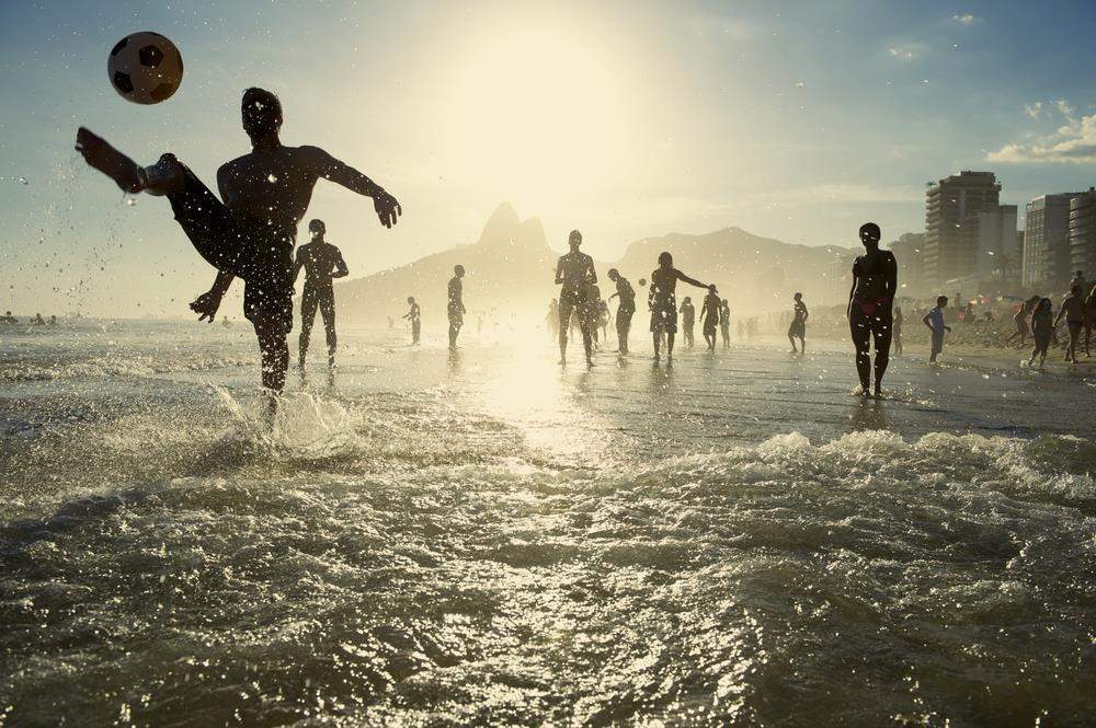 picture of people playing football in the sea