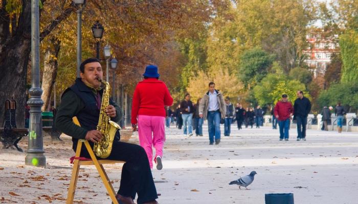 picture of man playing saxophone in the park